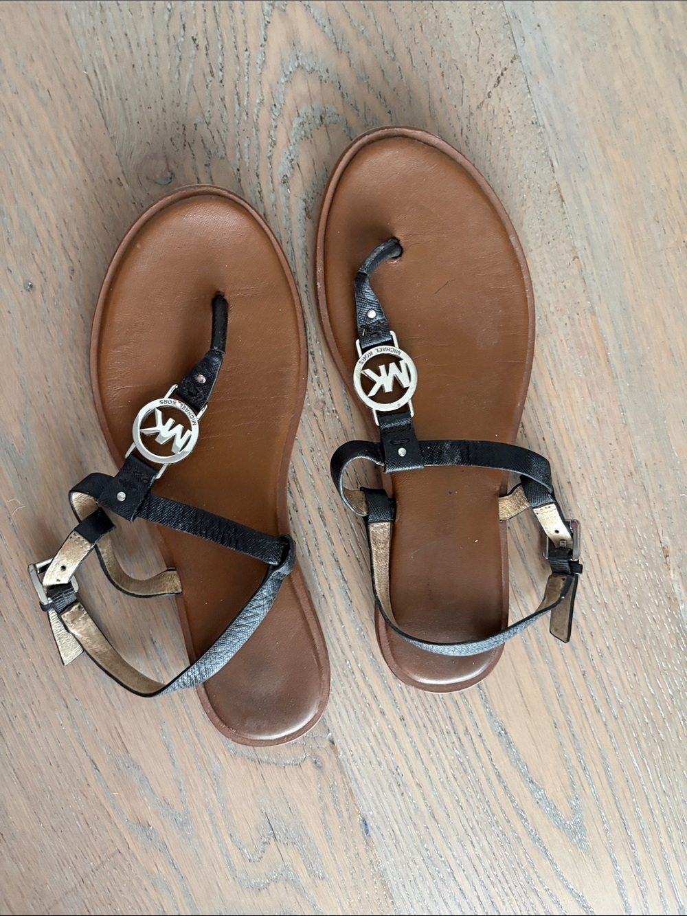 Michael Kors Black Leather T-Strap Sandals with Brown Footbed and Gold MK Logo